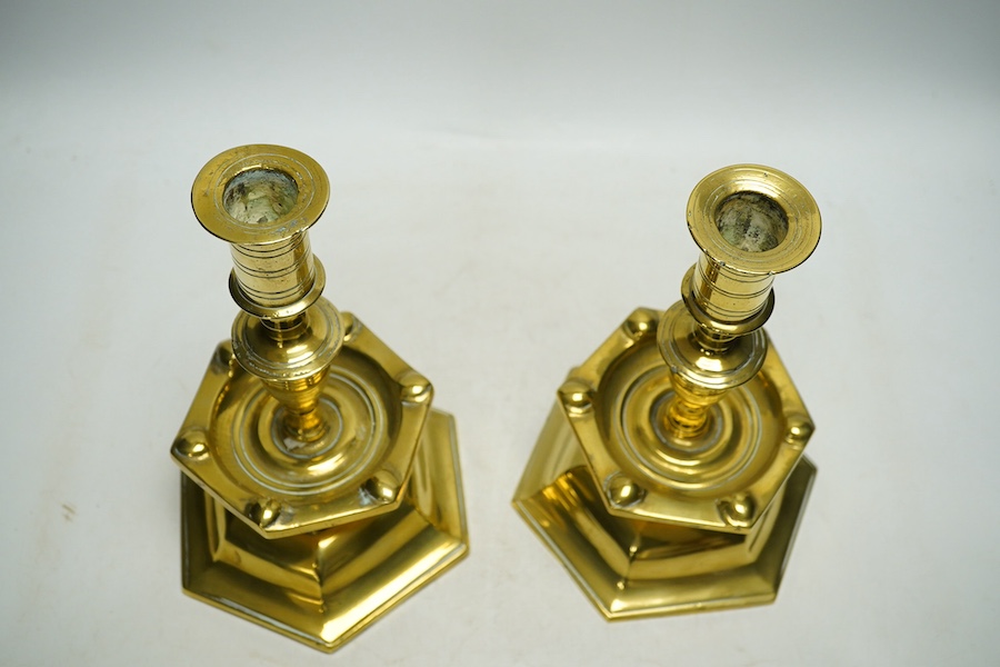 A pair of Dutch style 'Heemskerk' heavy cast brass candlesticks, on hexagonal bases, 24cm. Condition - fair to good